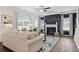 Cozy living room with a fireplace, a comfortable sofa, and a ceiling fan at 525 Lanier Way, Temple, GA 30179