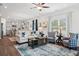 Spacious living room and kitchen area with modern furniture and decor at 525 Lanier Way, Temple, GA 30179