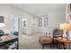 Loft area featuring a desk and seating area, with an entrance to a bathroom at 525 Lanier Way, Temple, GA 30179
