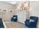 Bedroom featuring white walls, two blue accent chairs, and a chest of drawers at 525 Lanier Way, Temple, GA 30179