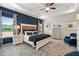 This bedroom has a blue accent wall, tray ceiling, large bed, and carpeted floor at 525 Lanier Way, Temple, GA 30179