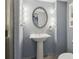 Bathroom featuring neutral walls, a sink with an oval mirror, and shower at 6067 Dana Dr, Norcross, GA 30093
