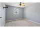 Bedroom featuring neutral walls, carpet, a window, and a ceiling fan at 6067 Dana Dr, Norcross, GA 30093
