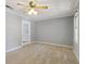 Bright bedroom with neutral carpet, overhead lighting, and white trim, perfect for relaxation at 6067 Dana Dr, Norcross, GA 30093