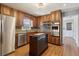 Well-appointed kitchen featuring stainless steel appliances, granite counters, and custom backsplash at 6067 Dana Dr, Norcross, GA 30093