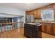 Spacious kitchen featuring a tiled island, stainless steel appliances, and an open view to the living area at 6067 Dana Dr, Norcross, GA 30093