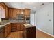 Stylish kitchen with wood cabinetry, stainless steel appliances, and a charming tiled island at 6067 Dana Dr, Norcross, GA 30093
