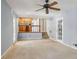 Bright living room with views into the kitchen, stairs, and glass-paned doors at 6067 Dana Dr, Norcross, GA 30093