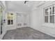 Cozy sunroom with slate floors, white painted brick, and lots of windows at 902 Edgewood Ne Ave, Atlanta, GA 30307