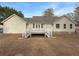 Back exterior view of home with two decks overlooking the backyard at 21 Fortson Dr, Hampton, GA 30228