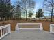 Backyard view from a deck with white railings overlooking a wooded area at 21 Fortson Dr, Hampton, GA 30228