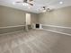 Large carpeted bonus room with stairs, recessed lighting, and ceiling fans at 21 Fortson Dr, Hampton, GA 30228