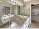 Elegant bathroom boasting double sinks, soaking tub, and granite countertops at 21 Fortson Dr, Hampton, GA 30228