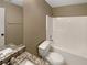 Bathroom featuring a granite countertop, a white shower-tub combination, and neutral walls at 21 Fortson Dr, Hampton, GA 30228