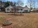 Inviting one-story home with lovely landscaping and a detached garage or shed at 21 Fortson Dr, Hampton, GA 30228