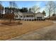 Beautiful home featuring manicured landscaping and a long driveway leading to the property at 21 Fortson Dr, Hampton, GA 30228