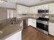 Well-equipped kitchen with stainless steel appliances and granite countertops at 21 Fortson Dr, Hampton, GA 30228