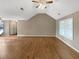 Open-concept living room with vaulted ceilings and hardwood floors at 21 Fortson Dr, Hampton, GA 30228