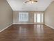 Spacious living room features beautiful hardwood floors and vaulted ceiling at 21 Fortson Dr, Hampton, GA 30228