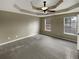 Spacious carpeted main bedroom with a ceiling fan and tray ceiling at 21 Fortson Dr, Hampton, GA 30228