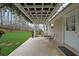 Covered back porch featuring outdoor seating, pergola, and views of the private backyard at 3114 Superior Dr, Dacula, GA 30019