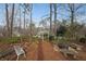 Landscaped backyard with a fire pit and benches, offering a relaxing space with a view of the home at 3114 Superior Dr, Dacula, GA 30019