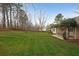 Expansive backyard with lush green grass and a charming covered patio area, perfect for entertaining at 3114 Superior Dr, Dacula, GA 30019