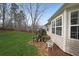 Well-maintained backyard featuring lush lawn, stone path, mature trees, and beautiful landscaping at 3114 Superior Dr, Dacula, GA 30019