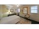 Bright bonus room with a massage table, rug, chair, mirrors, and natural light at 3114 Superior Dr, Dacula, GA 30019