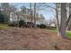 Charming two-story home with a front yard covered in pine straw and mature trees at 3114 Superior Dr, Dacula, GA 30019