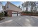 Spacious two-car garage with ample parking space and a well-maintained driveway at 3114 Superior Dr, Dacula, GA 30019