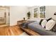 Stylish bedroom features hardwood floors, a comfortable bed with decorative pillows, and a view to the doorway at 435 10Th Ne St # 18, Atlanta, GA 30309