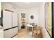 Charming dining area features a cozy table setup, modern appliances, and a stylish refrigerator at 435 10Th Ne St # 18, Atlanta, GA 30309