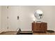 Welcoming entryway with a wooden cabinet, stylish mirror, and contemporary decor at 435 10Th Ne St # 18, Atlanta, GA 30309
