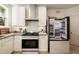 Well-equipped kitchen with white cabinets, granite counters, and stainless steel appliances at 435 10Th Ne St # 18, Atlanta, GA 30309