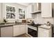 Well-lit kitchen featuring modern appliances, granite countertops, and ample cabinet space at 435 10Th Ne St # 18, Atlanta, GA 30309