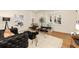 Elegant living room with modern furnishings, neutral colors, and natural light through French doors at 435 10Th Ne St # 18, Atlanta, GA 30309