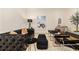 Sophisticated living room with a tufted sofa, accent chairs, and curated artwork at 435 10Th Ne St # 18, Atlanta, GA 30309