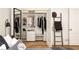 Organized walk-in closet with shelves, drawers, hanging rods, and stylish accents for optimal storage at 435 10Th Ne St # 18, Atlanta, GA 30309