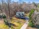 Aerial shot of a cozy home nestled among mature trees on a large lot at 504 Hanover Ct, Woodstock, GA 30188