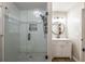 Bright bathroom features a glass shower door, vanity with sink, and modern finishes at 504 Hanover Ct, Woodstock, GA 30188