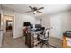 Bedroom with neutral walls, ceiling fan, and plush carpet, ideal for comfort and relaxation at 504 Hanover Ct, Woodstock, GA 30188