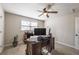 Bedroom featuring a ceiling fan and large window, perfect for a home office setup at 504 Hanover Ct, Woodstock, GA 30188