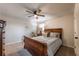Inviting bedroom showcases a ceiling fan, a stylish bed, and a neutral color palette at 504 Hanover Ct, Woodstock, GA 30188