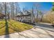 View of a home featuring well-manicured lawns and a paved driveway, ideal for curb appeal at 504 Hanover Ct, Woodstock, GA 30188