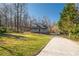 Front exterior view of the house, showcasing its inviting front porch, well-maintained lawn, and curb appeal at 504 Hanover Ct, Woodstock, GA 30188