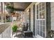 Cozy front porch with comfortable seating area to relax and enjoy the outdoors at 504 Hanover Ct, Woodstock, GA 30188