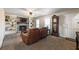 Spacious living room with a fireplace, built-in shelving, and comfortable leather seating at 504 Hanover Ct, Woodstock, GA 30188