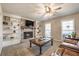 Inviting living room with a brick fireplace, built-in shelves, and plush seating at 504 Hanover Ct, Woodstock, GA 30188