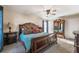 Comfortable main bedroom with a ceiling fan, stylish furnishings, and ample closet space at 504 Hanover Ct, Woodstock, GA 30188